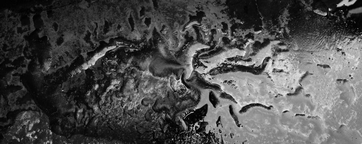 Black and white sandy terrain.